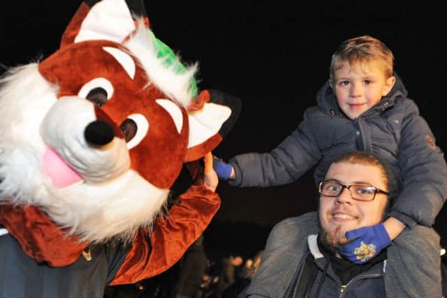 Mansfield Woodhouse firework event.    
High fives at the firework display for Jenson and Chris Handley.