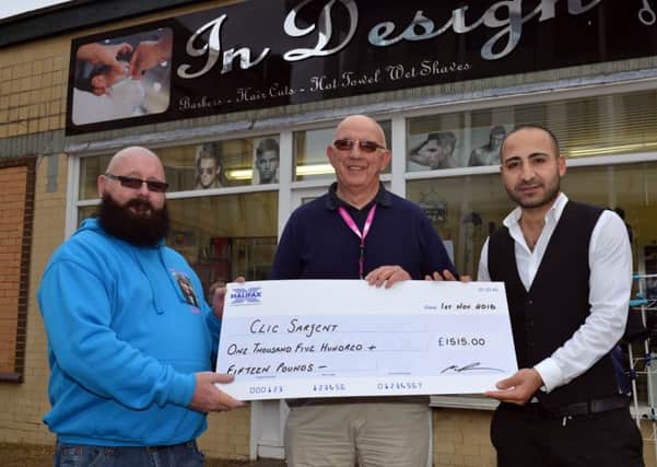 Martin McShane has raised over Â£2000 for Clic Sargent by growing a beard for a year, pictured from left are Martin McShane, Gordon Jeffrey, volunteer for Clic Sargent and Ali Ozcan of In design barbers
