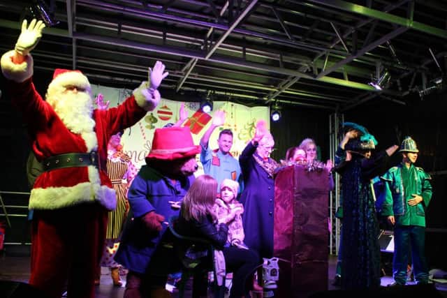 CHRISTMAS STAR -- last years auction winner, Lillie-May Holey, on stage at Mansfields Big Switch-On.