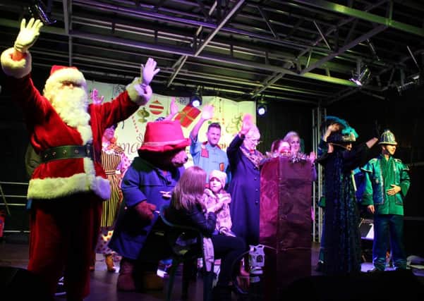 CHRISTMAS STAR -- last years auction winner, Lillie-May Holey, on stage at Mansfields Big Switch-On.