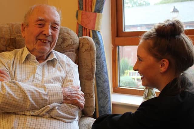 HAVING A GOOD LAUGH -- a Maun View resident sharing a humorous moment or two with pupil Ellie Smith.