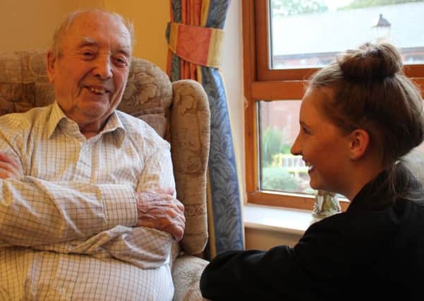 HAVING A GOOD LAUGH -- a Maun View resident sharing a humorous moment or two with pupil Ellie Smith.