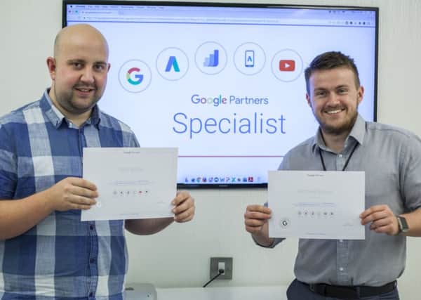 DIGITAL SPECIALISTS -- Purpose Media duo Rob White and Mitch Brown with their Google certificates.