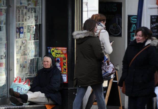A homeless person in a shop front. Picture: Andrew Roe