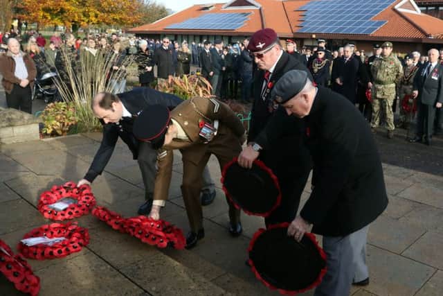 Serving and former servicemen lay their wreaths.
