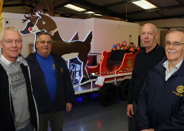 Rotarians, Terry Moult, Robert Copley, Andrew Stone and Allan Johnson with the Christmas sleigh which has been refurbished with new lighting thanks to Hucknall's Oshino Light Ltd.