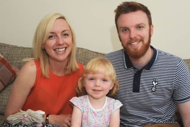 Charlotte and Chris Novell with their daughter Elsie, pictured at their Sutton home.