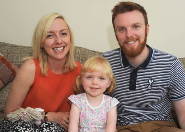 Charlotte and Chris Novell with their daughter Elsie, pictured at their Sutton home.