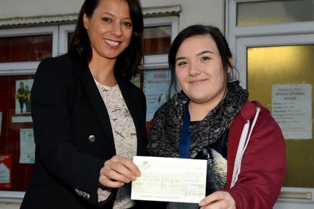 GENEROUS GLORIA -- Ashfield MP Gloria De Piero presents the Â£800 cheque to student Courteney Clark.