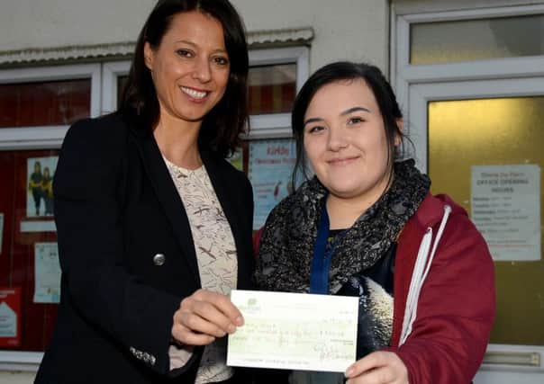GENEROUS GLORIA -- Ashfield MP Gloria De Piero presents the Â£800 cheque to student Courteney Clark.