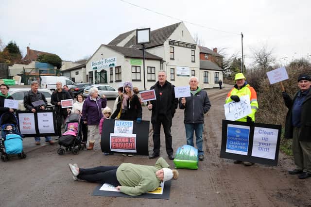 Protesters had a 'lie-down' in the road to prevent trucks transporting dirt onto Brierley Forest Golf Club.