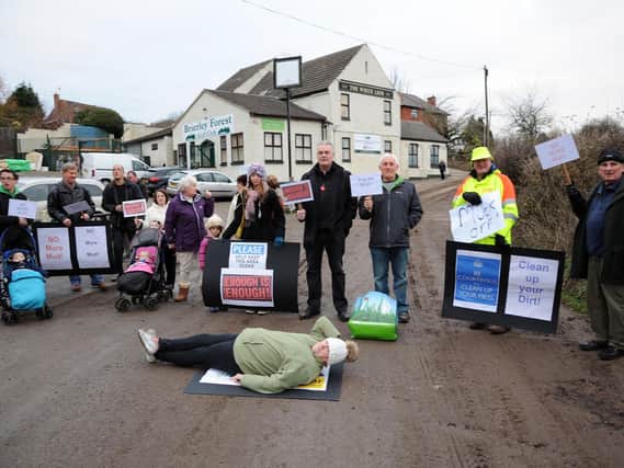 Protesters had a 'lie-down' in the road to prevent trucks transporting dirt onto Brierley Forest Golf Club.
