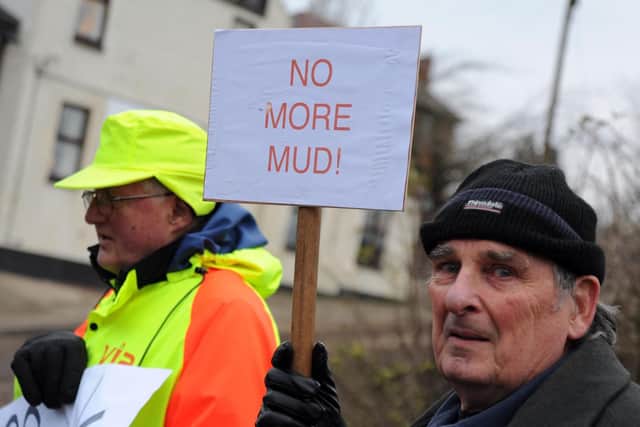 The local residents are angry with mud being trawled through the streets of the village despite calls for the golf club to act.