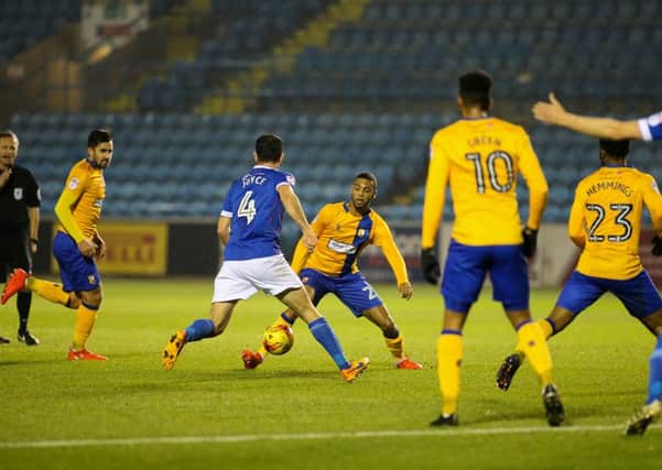 Mansfield Town's CJ Hamilton looks to make the pass - Pic by Chris Holloway