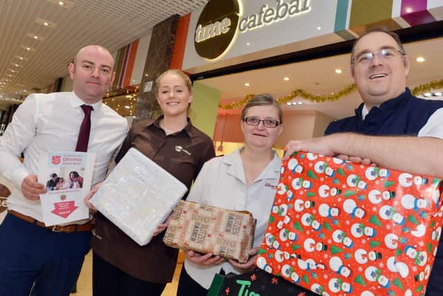 Launch of Christmas present appeal at Time Cafe bar in Mansfields four Seasons. Manager Alan Holmes, Eleanor Lowe, Major Anita Cotterill and Major Nick Cotterill.