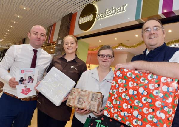 Launch of Christmas present appeal at Time Cafe bar in Mansfields four Seasons. Manager Alan Holmes, Eleanor Lowe, Major Anita Cotterill and Major Nick Cotterill.