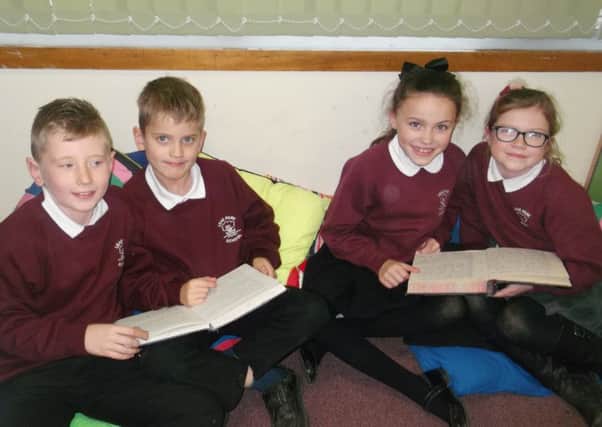 Leas Park Junior school pupils read the school logs from the 1960s and 70s.
