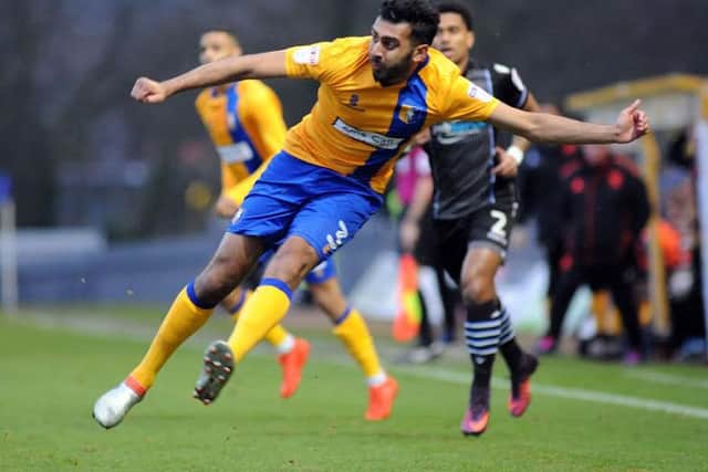 Mansfield Town v Colchester United.Mal Benning puts in a first half cross.