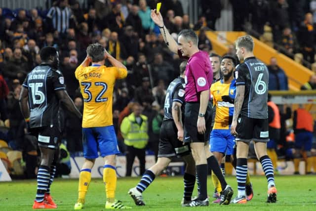 Mansfield Town v Colchester United.
Danny Rose is yellow carded for a dive in added time.