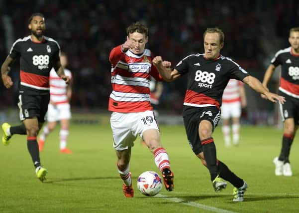 Liam Mandeville and David Vaughan challenge for the ball.
Doncaster Rovers v Nottingham Forest. EFL Cup 1st round.  9 August 2016.  Picture Bruce Rollinson