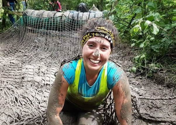 Superhero Lizzie Smith still smiling after battling through one of her obstacle races this year.