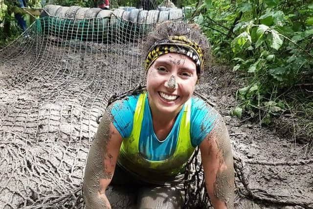 Superhero Lizzie Smith still smiling after battling through one of her obstacle races this year.