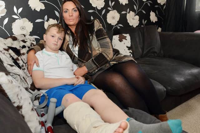 Oliver Caske suffered a broken leg at play centre. Pictured with Mum Amanda.