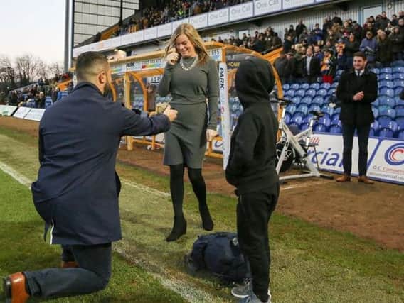 Stags fans cheered as a supporter proposed to his new fiance at the pitchside.