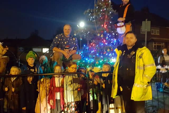 Selston residents decorate the village Christmas tree after an appeal on the #SelstonTogether Facebook group.