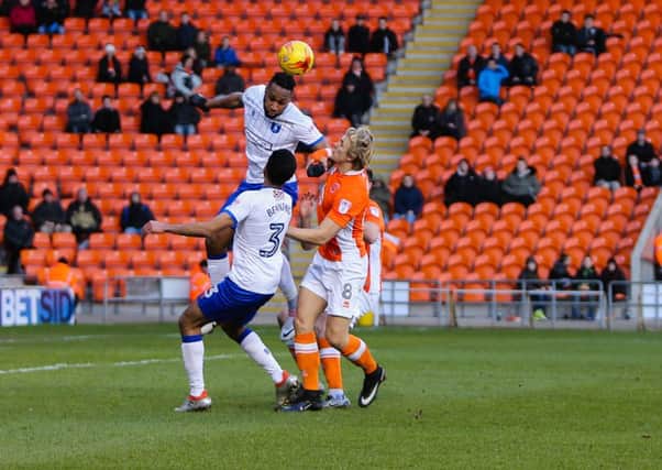 Mansfield Town's Yoann Arquin wins the header - Pic by Chris Holloway