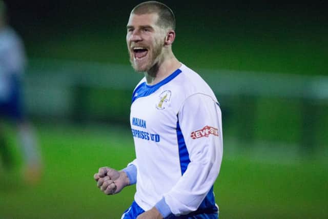 All smiles from striker Craig Mitchell, who scored two of Teversals goals in their magnificent win over leaders AFC Emley.