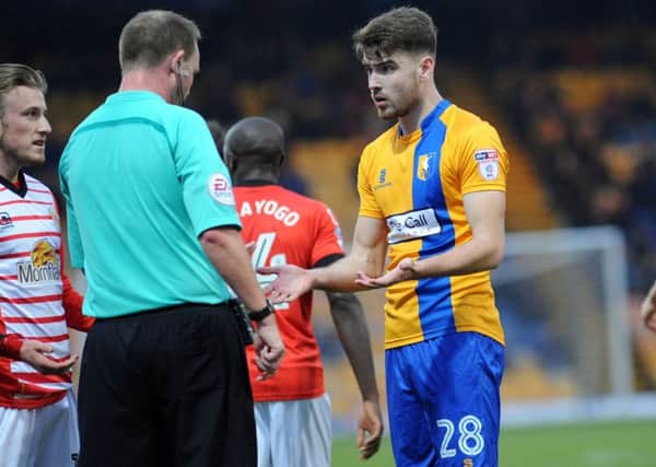 Mansfield Town v Crewe Alexander.
New signing Ben Whiteman appeals to the referee Mark Brown before receiving a yellow card.