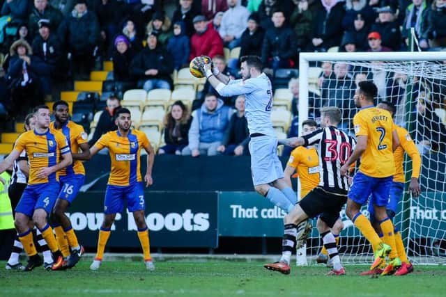 Mansfield Town's Jake Kean wins the ball - Pic by Chris Holloway