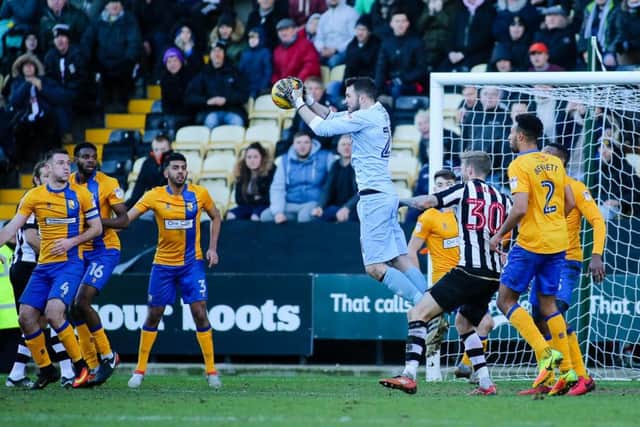 Mansfield Town's Jake Kean wins the ball - Pic by Chris Holloway