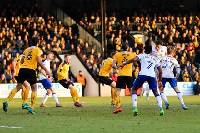 Mansfield Town's Rhys Bennett heads for goal - Pic by Chris Holloway