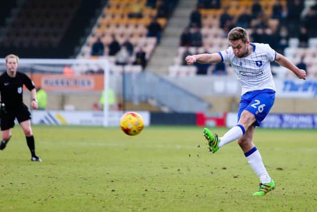 Mansfield Town's Joel Byrom shoots for goal in the 3-1 win at Cambridge United. Photo by Chris Holloway