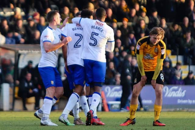 Stags players congratulate Rhys Bennett after their equaliser at Cambridge. (PHOTO BY: Chris Holloway).