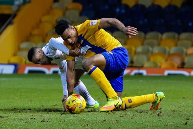 Mansfield Town's Ryhs Bennett keeps possession - Pic by Chris Holloway