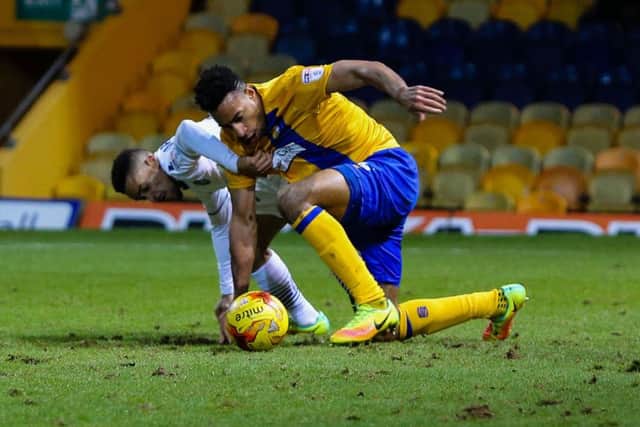 Mansfield Town's Ryhs Bennett keeps possession - Pic by Chris Holloway