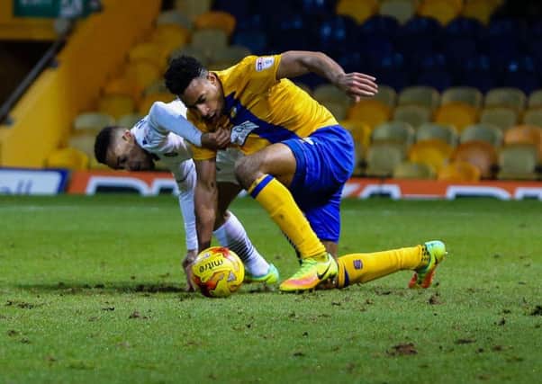 Mansfield Town's Ryhs Bennett keeps possession - Pic by Chris Holloway