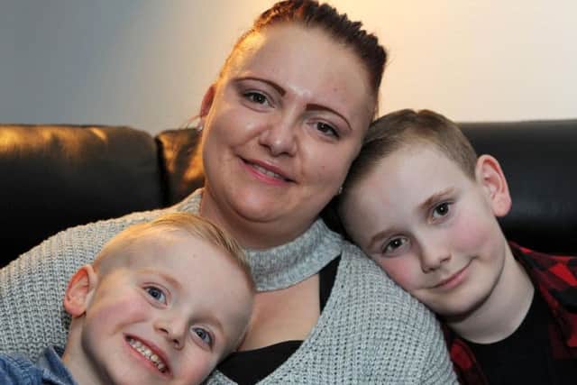 Carter, at home with mum Jodi and brother Braiden.