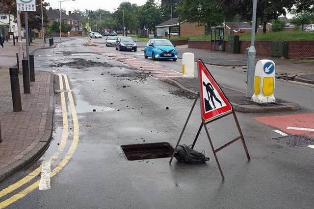 The aftermath of the floods left Ladybrook Lane damaged and manholes open. (Image courtesy Richard Martin)