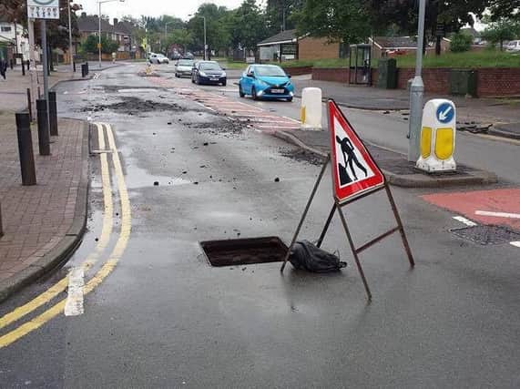 The aftermath of the floods left Ladybrook Lane damaged and manholes open. (Image courtesy Richard Martin)