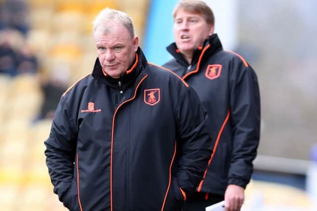 Mansfield Town Manager Steve Evans with assistant Paul Raynor behind.
Picture by Dan Westwell.