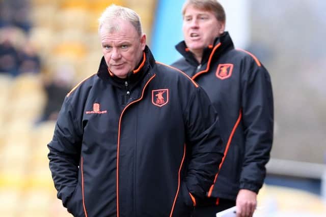 Mansfield Town Manager Steve Evans with assistant Paul Raynor behind.Picture by Dan Westwell.