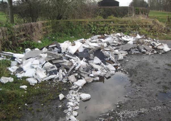 A separate example of the kind of fly-tipping often found by councils.