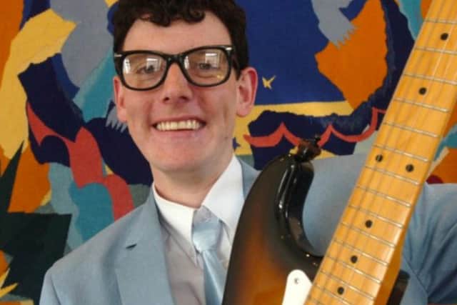 Andrew Morley as his idol Buddy Holly