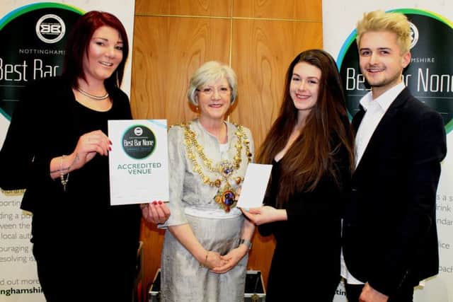 Staff at After Dark receive the nightclubs distinction certificate from Executive Mayor, Coun Kate Allsop.