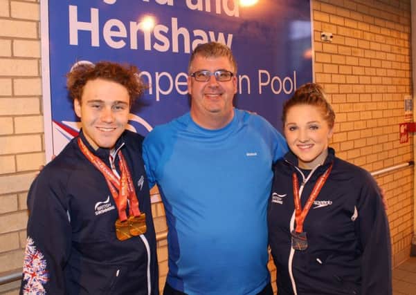Performance coach of the year Glenn Smith (centre) with two of his proteges, star Paralympians Ollie Hynd and Charlotte Henshaw.