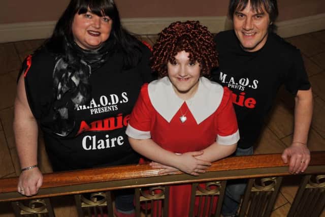 Ella Wragg from Huthwaite is to play Annie at the Palace Theatre in March. Pictured with her mum Claire and dad Ian.